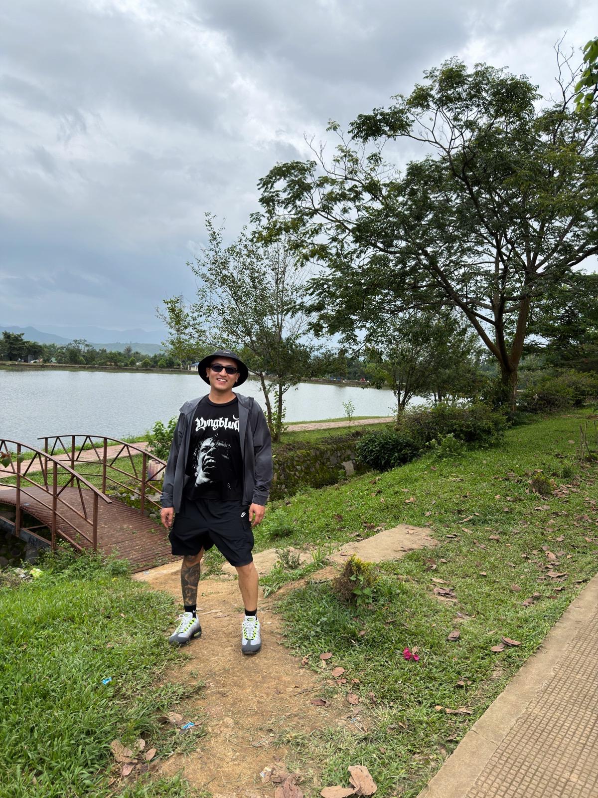 Jamson Hiroyuki standing beside a lake