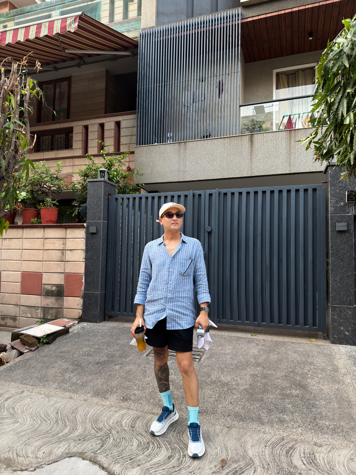 Jamson Hiroyuki outdoors in a blue striped shirt